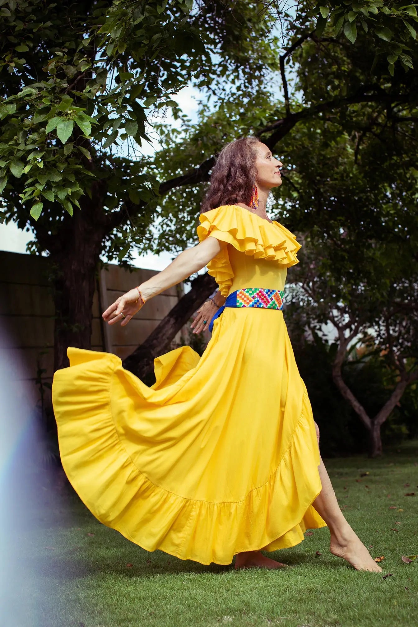 Rainbow Belt and yellow dress with model dancing